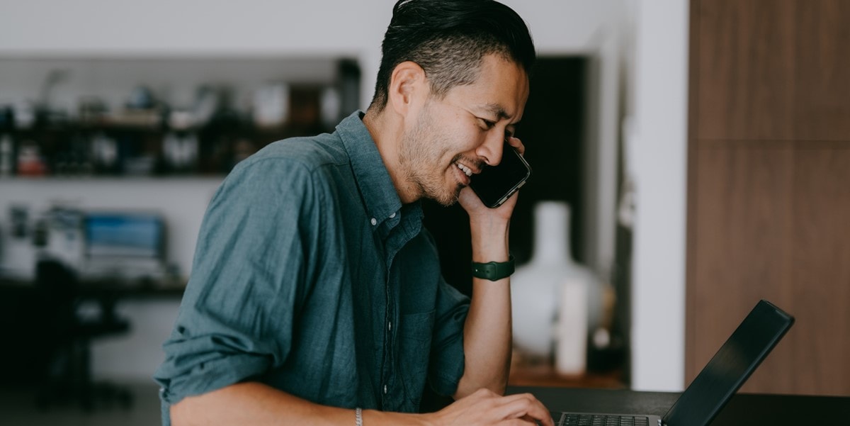 man in office talking on the phone